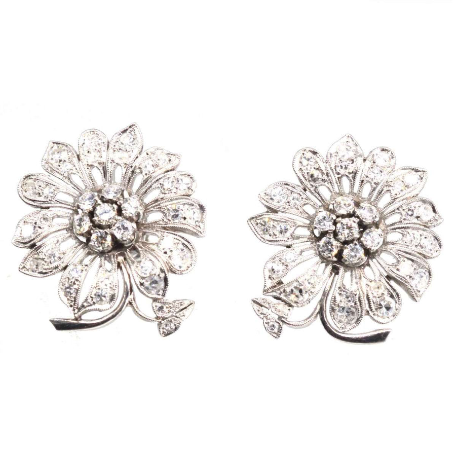1940s 18ct white gold diamond flower cluster earrings with sparkling diamond petals and central cluster.