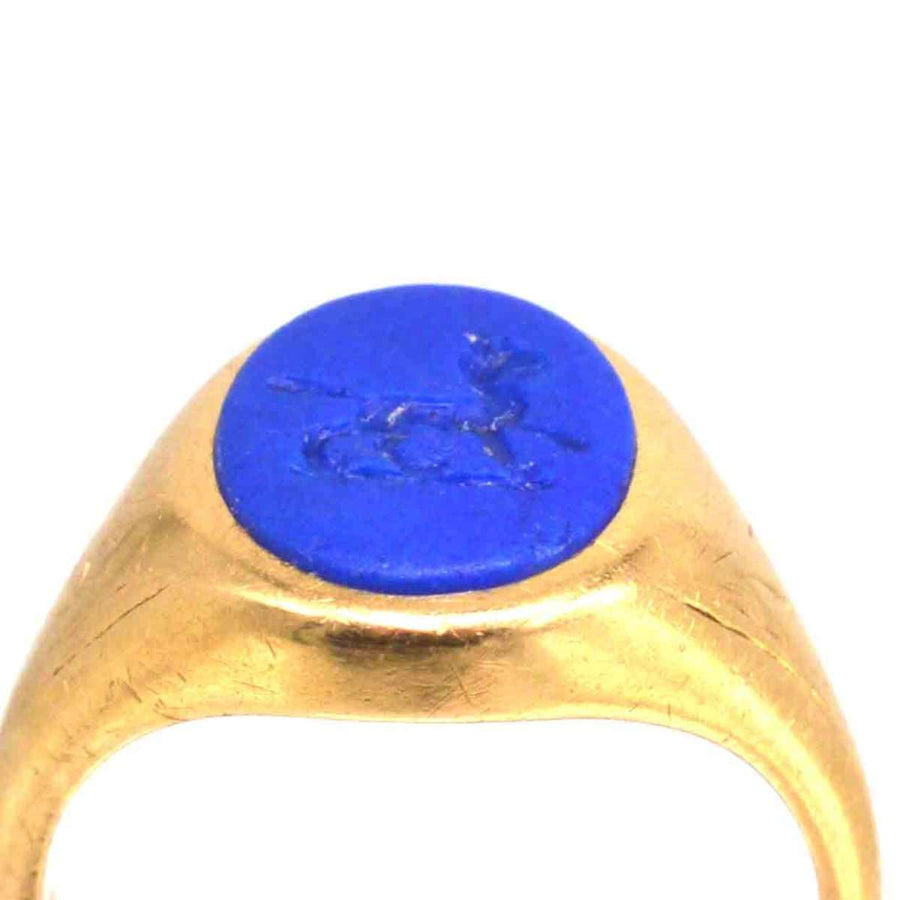 1960s 18ct gold signet ring with lapis lazuli intaglio depicting a wolf, bold heraldic design.
