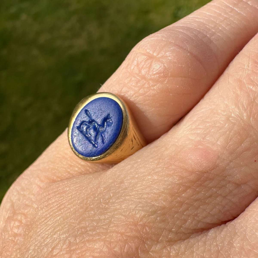 1960s 18ct gold signet ring with lapis lazuli intaglio of a wolf, showcasing a unique family crest design.