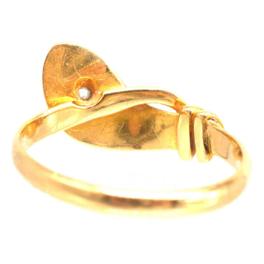 Edwardian 18ct gold snake ring with a decorative tail and gemstone detailing.