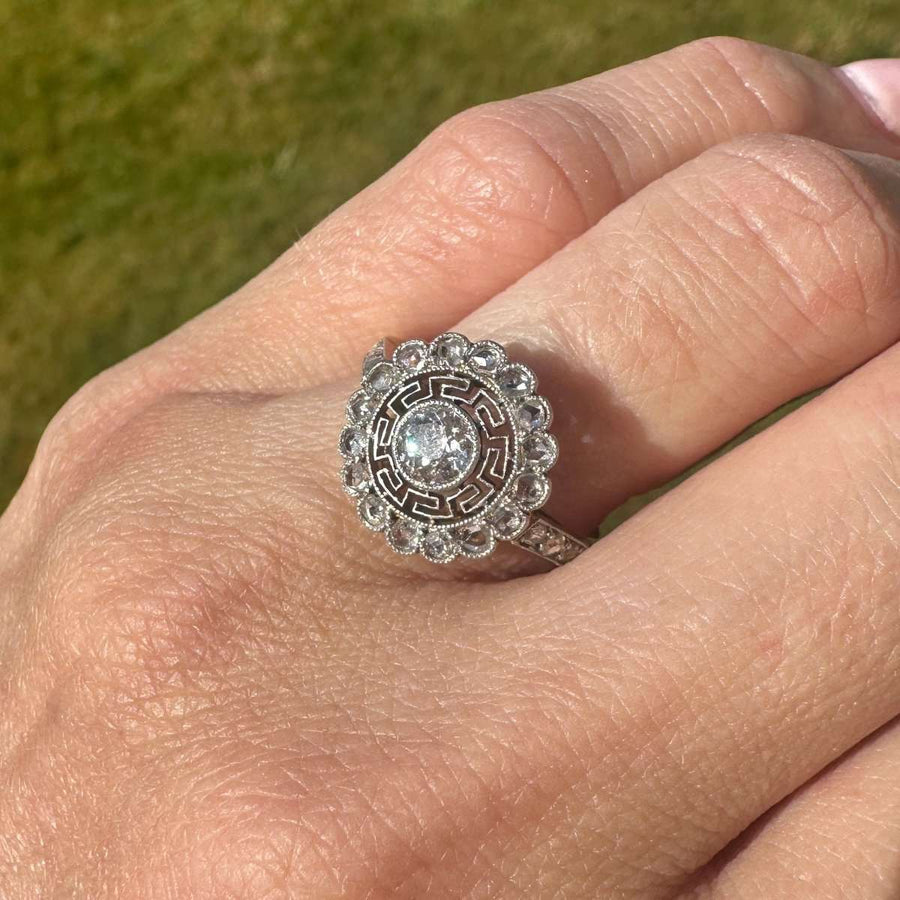 Art Deco 18ct gold and platinum target diamond ring with Greek key details, showcasing an Old European Cut diamond.
