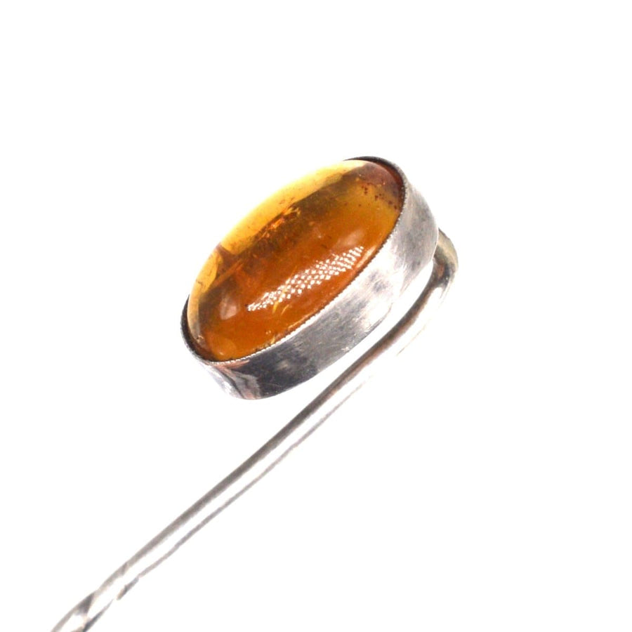Art Deco silver tie pin featuring stunning amber, circa 1920s, perfect for adding elegance to any outfit.