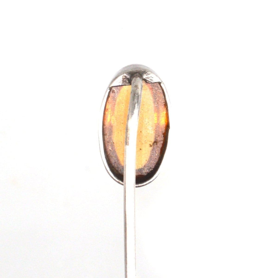 Art Deco silver tie pin with natural amber, showcasing striking color and vintage 1920s design.
