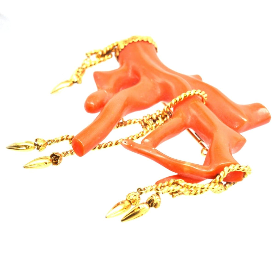 Large 19th century red coral brooch with gold tassel details, showcasing extravagant rocaille style.