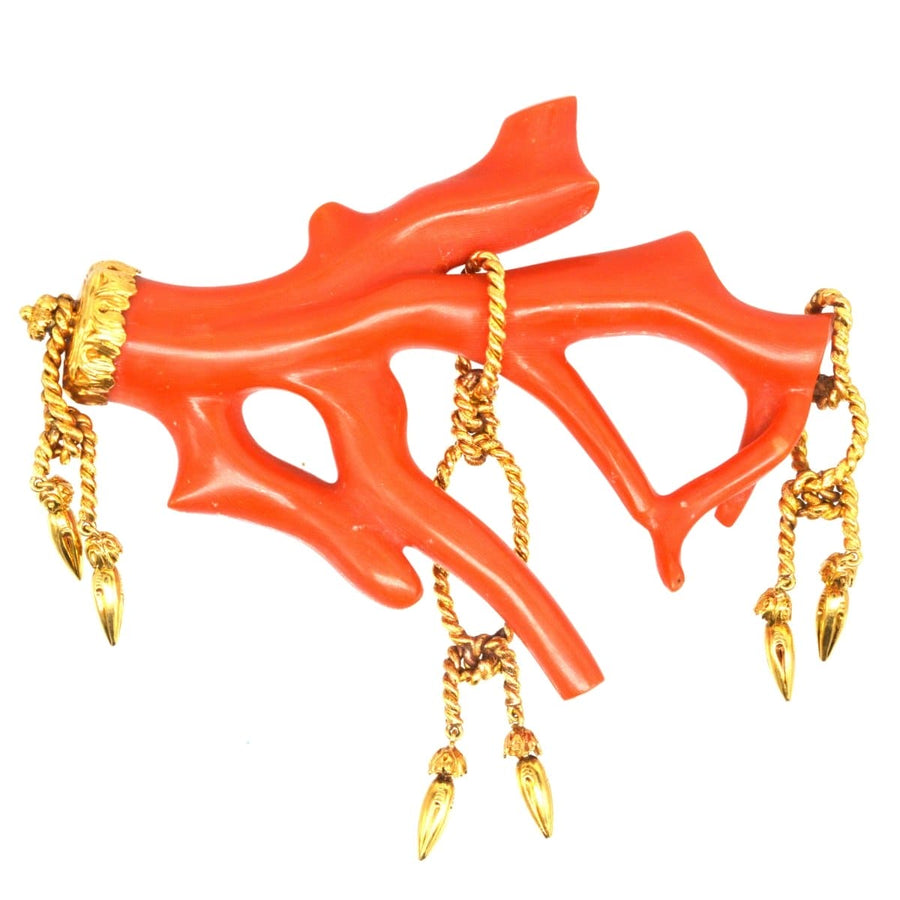 Large red coral brooch with gold rope tassels, showcasing an extravagant rocaille design.