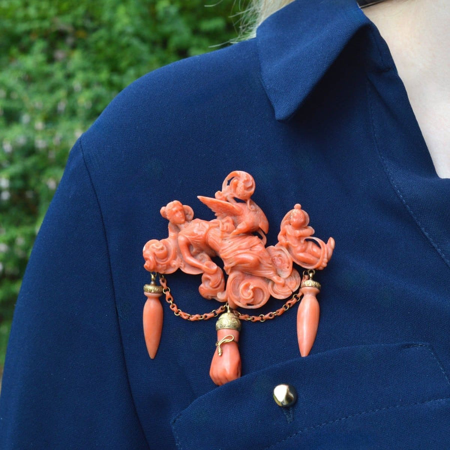 Large rare antique coral brooch depicting goddess Hebe, Zeus, and Cupid, detailed carving with hanging accents.