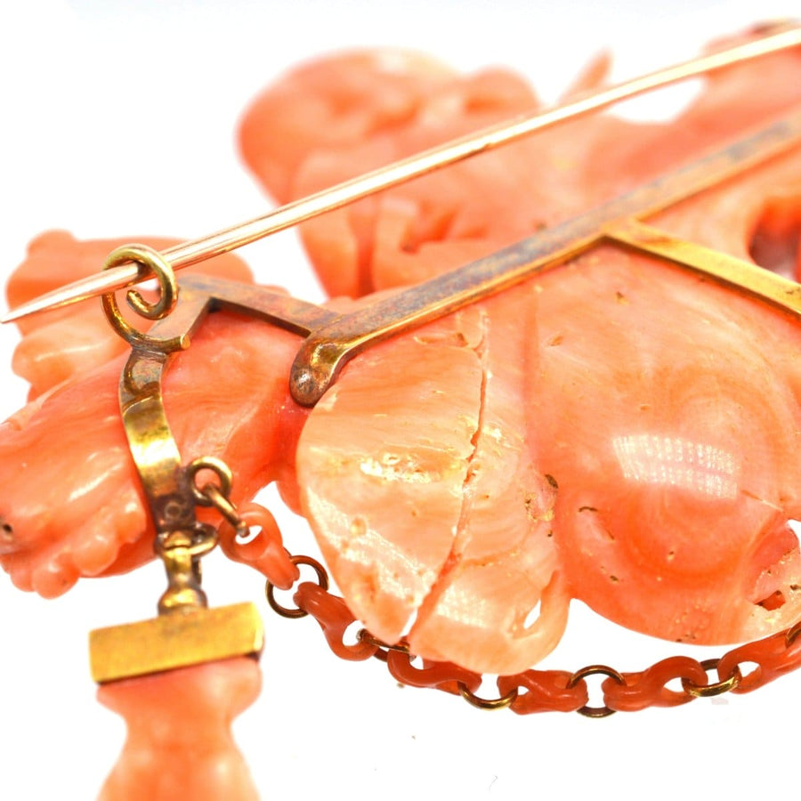 Large antique Italian carved coral brooch featuring Goddess Hebe, Zeus, and Cupid, showcasing intricate details.