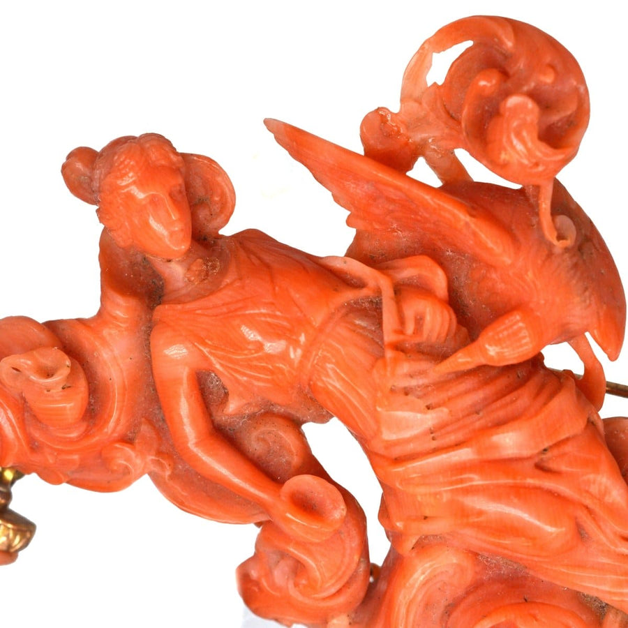 Large antique carved coral brooch depicting goddess Hebe with Zeus and Cupid in intricate detail.