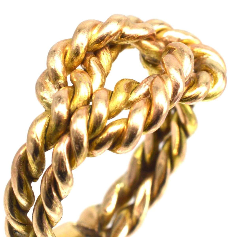 Large Victorian 9ct gold rope lover's knot ring with intricate braided design symbolizing love and unity.