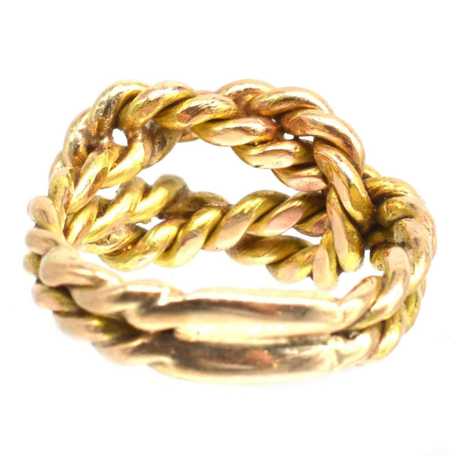 Large Victorian 9ct gold rope lover's knot ring showcasing a braided design symbolizing love and unity.