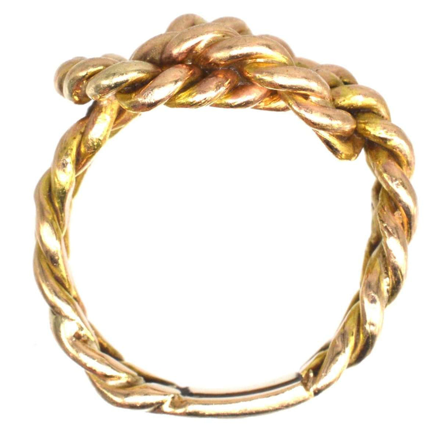 Large Victorian 9ct gold rope lover's knot ring showcasing intricate braided design symbolizing love and unity.