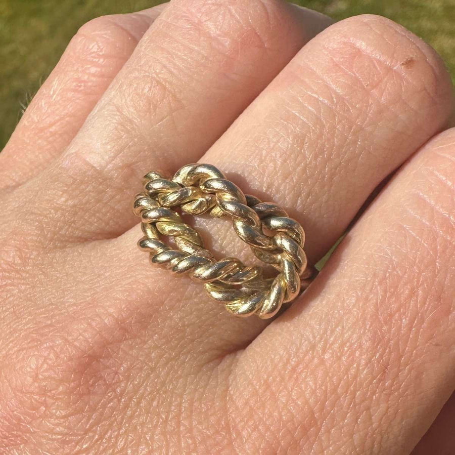 Large Victorian 9ct gold rope lover's knot ring showcasing a braided design symbolizing love and unity.