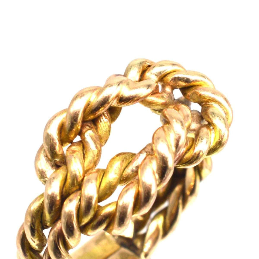 Large Victorian 9ct gold rope lover's knot ring with intricate braided design symbolizing love and unity.