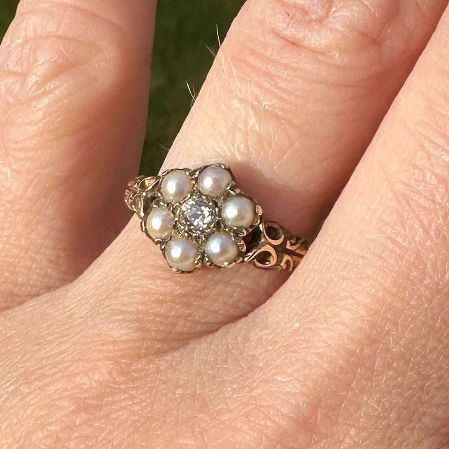 Late Victorian 9ct gold cluster ring with split pearls and diamond, showcasing 19th-century romantic jewelry design.
