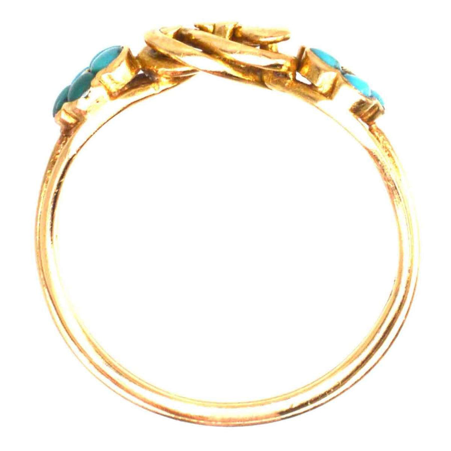 Regency 18ct gold knot ring featuring turquoise forget-me-not flowers, symbolizing love and remembrance.