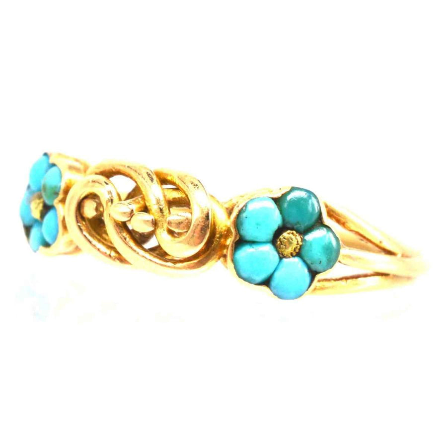 Regency 18ct gold knot ring with turquoise forget-me-not flowers, symbolizing love and remembrance.