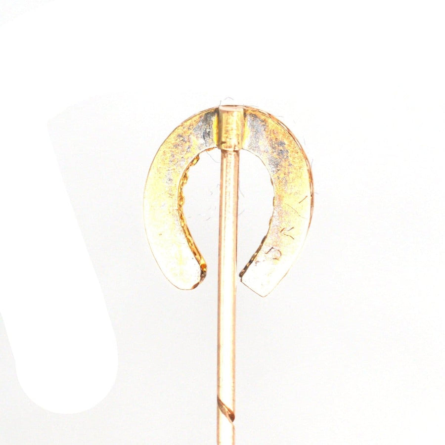 Victorian 15ct Gold Horseshoe Tie Pin, embellished with rubies and diamonds, symbolizing luck and love.