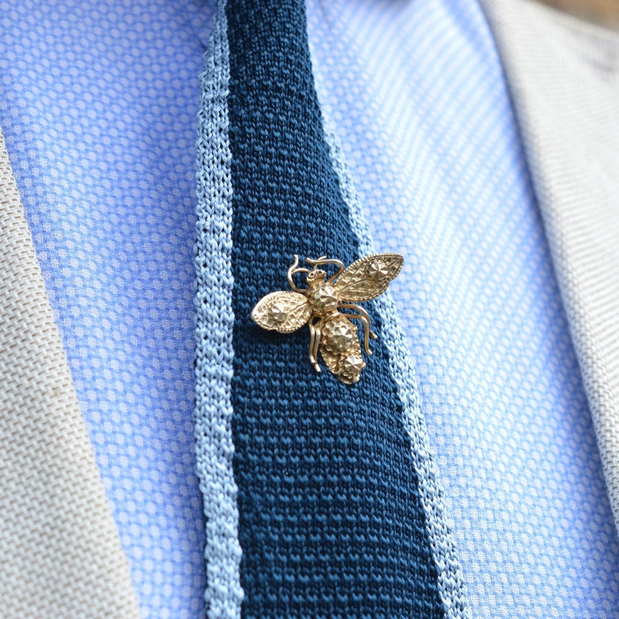 Early 19th Century star punch silver bee tie pin on a silk tie, showcasing fine craftsmanship and modern design.