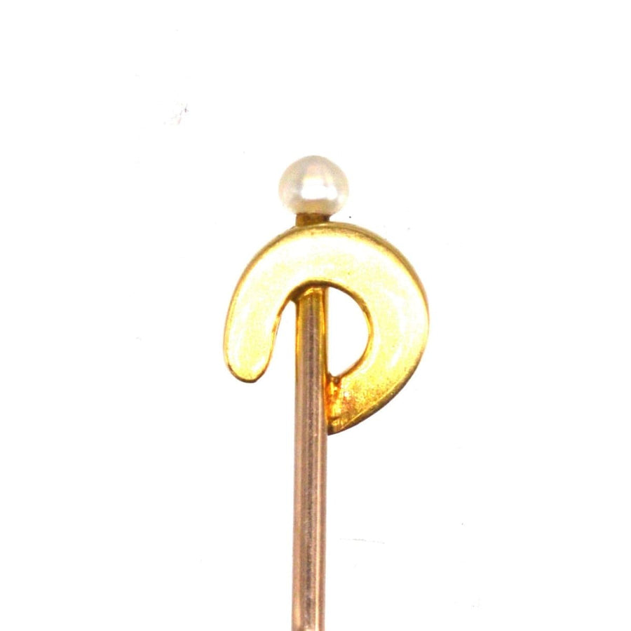Edwardian 15ct gold pearl horseshoe tie pin with natural pearl, symbolizing luck and protection.