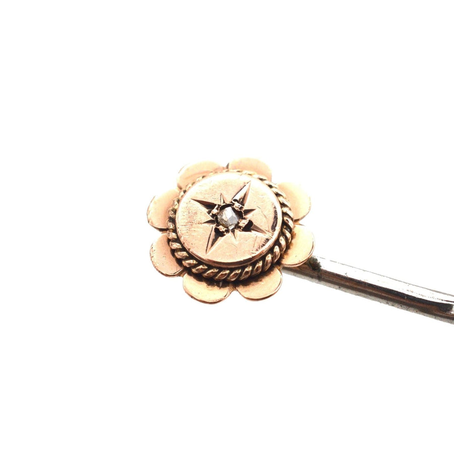Late Victorian 9ct gold tie pin featuring a star motif and diamond, with an elegant rope detail.