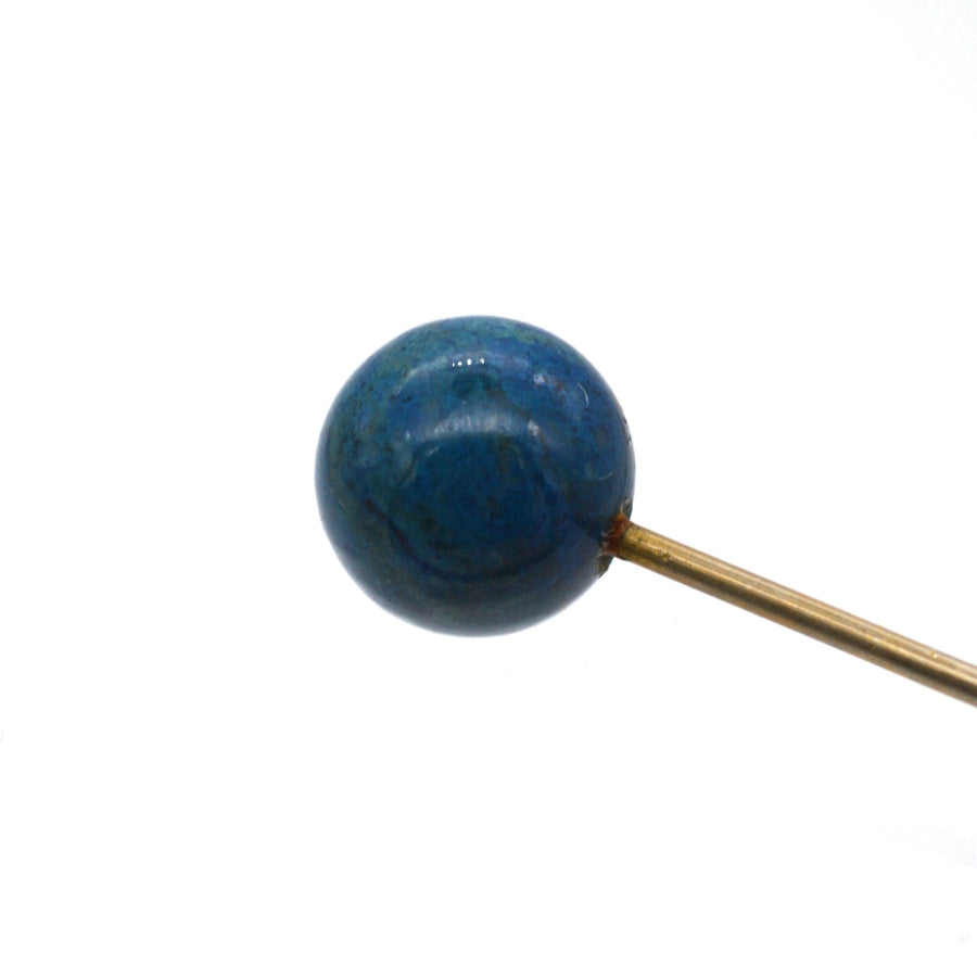Victorian gold tie pin featuring a stunning Lapis Lazuli sphere, ideal for vintage fashion enthusiasts.